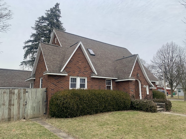 view of side of property featuring a yard