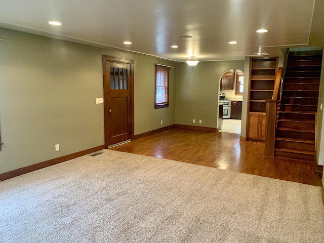 unfurnished living room with carpet flooring