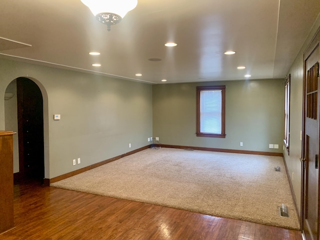 spare room with hardwood / wood-style flooring