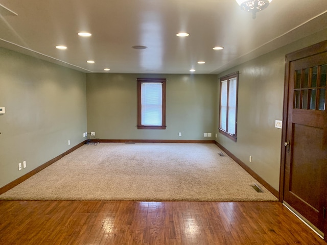 unfurnished room with hardwood / wood-style flooring