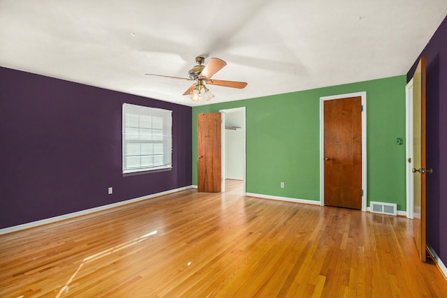 unfurnished bedroom featuring ceiling fan and light hardwood / wood-style floors