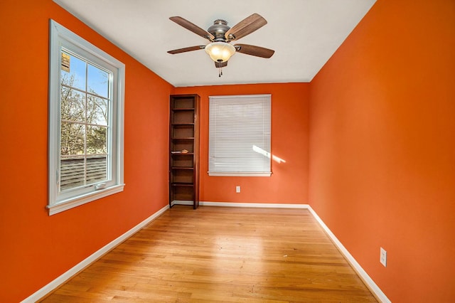 spare room featuring ceiling fan and light wood-type flooring