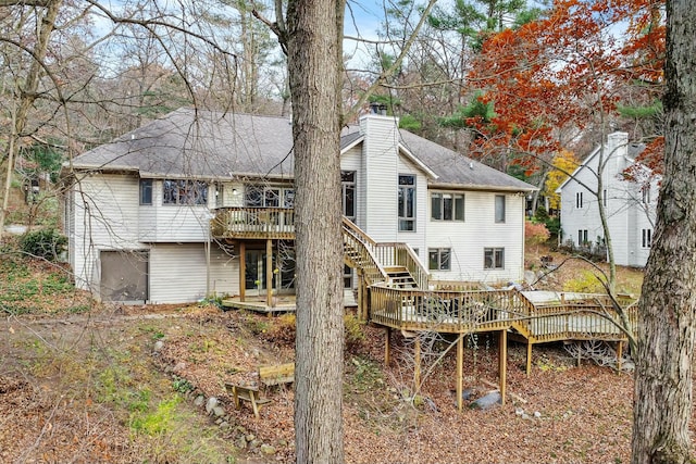 back of property featuring a deck