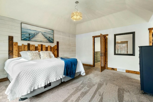 carpeted bedroom with lofted ceiling, an inviting chandelier, and wooden walls