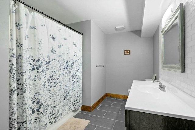 bathroom with a shower with curtain, tile patterned floors, and vanity