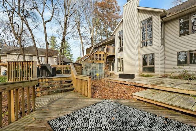 view of side of home featuring a wooden deck