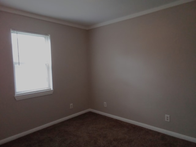 unfurnished room with dark carpet