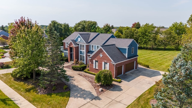 view of front of home with a garage and a front yard