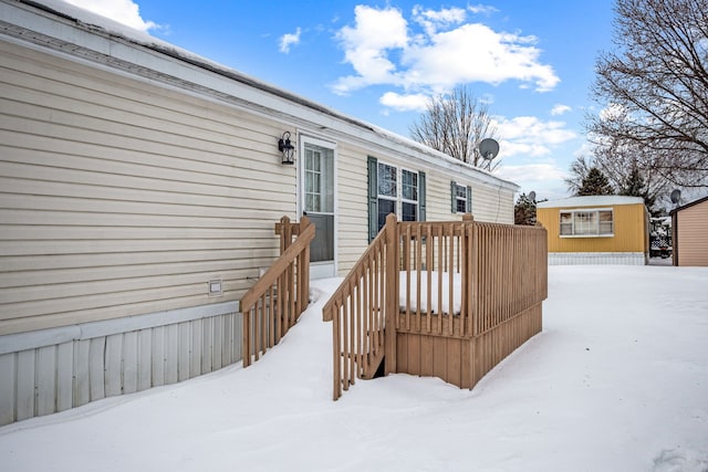 view of snow covered deck