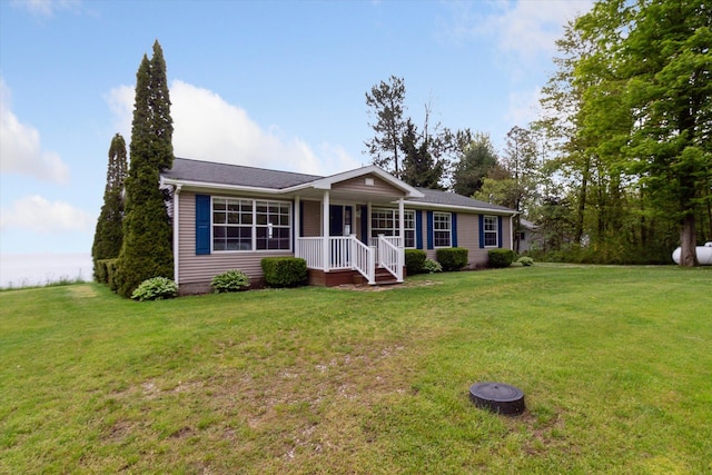 ranch-style home with a front lawn