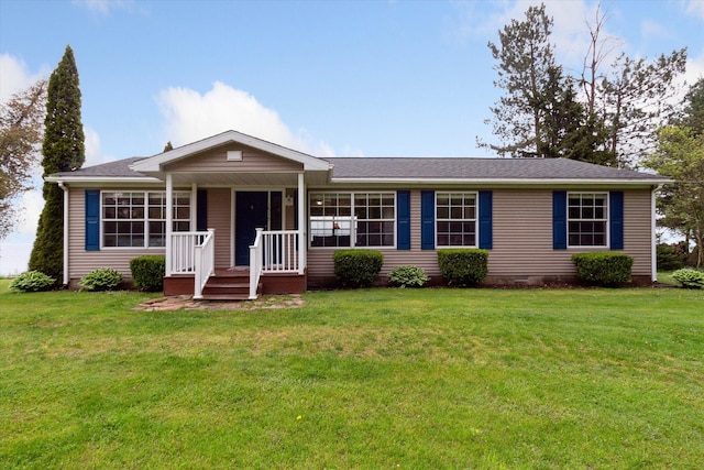 ranch-style house featuring a porch and a front lawn