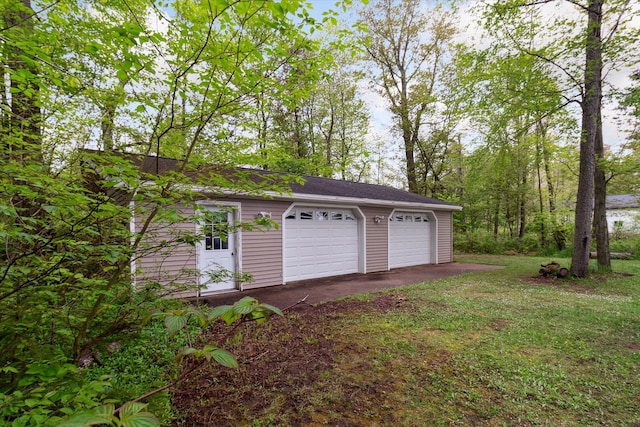 garage with a lawn