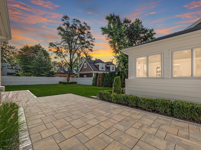 patio terrace at dusk with a lawn