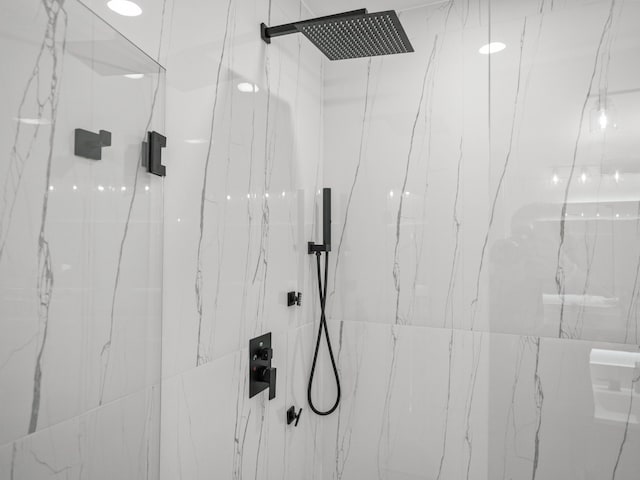 bathroom with a tile shower