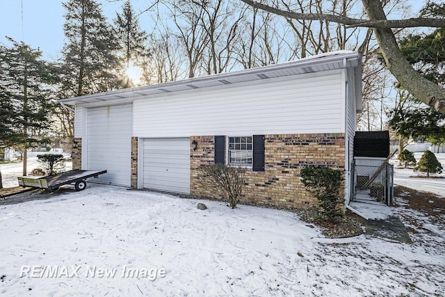 view of snow covered garage