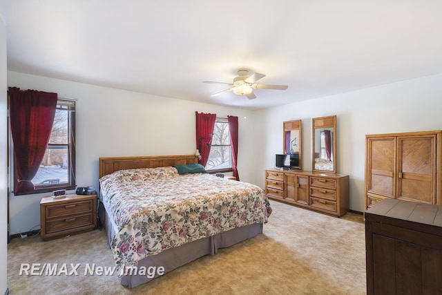 carpeted bedroom with ceiling fan