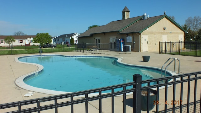 view of pool with central AC and a patio