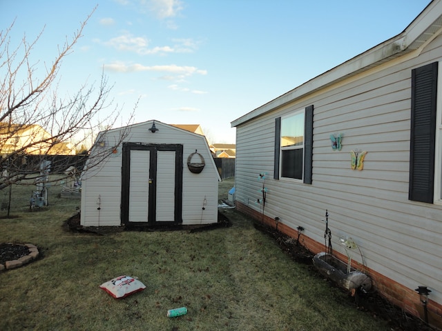 outdoor structure at dusk with a yard