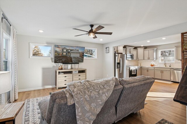 177 E Lowry, Brooklyn, MI 49230 - living room featuring ceiling fan, light wood-type flooring, baseboards, and recessed lighting