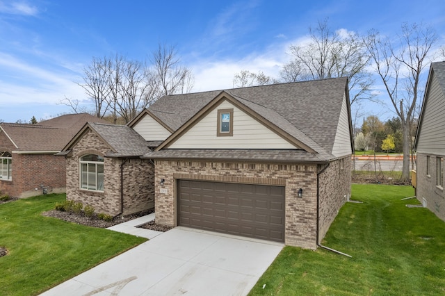 view of front of house featuring a garage and a front lawn