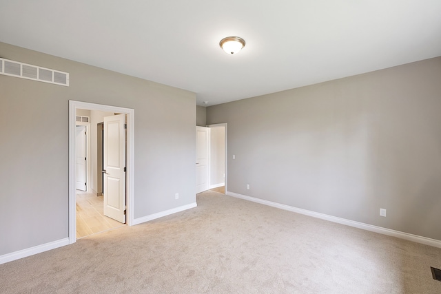 unfurnished bedroom featuring light colored carpet