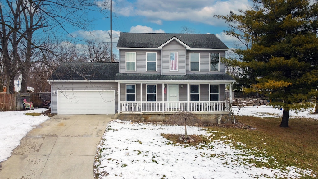 view of front of house with a garage and a porch