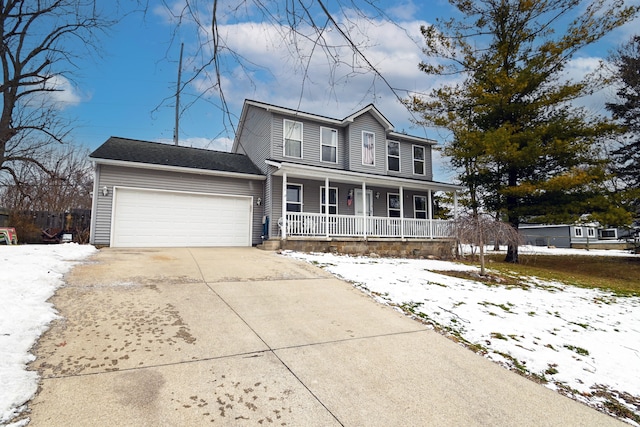 view of front facade with a garage and covered porch