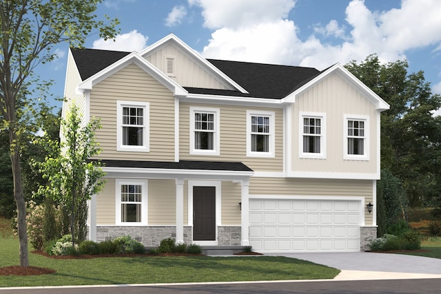 view of front of home with a garage and a front lawn