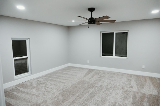 unfurnished room with recessed lighting, carpet, and baseboards