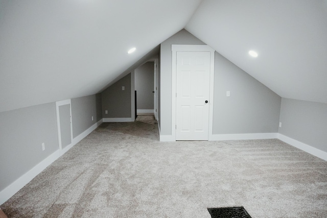 bonus room featuring vaulted ceiling, visible vents, baseboards, and carpet floors