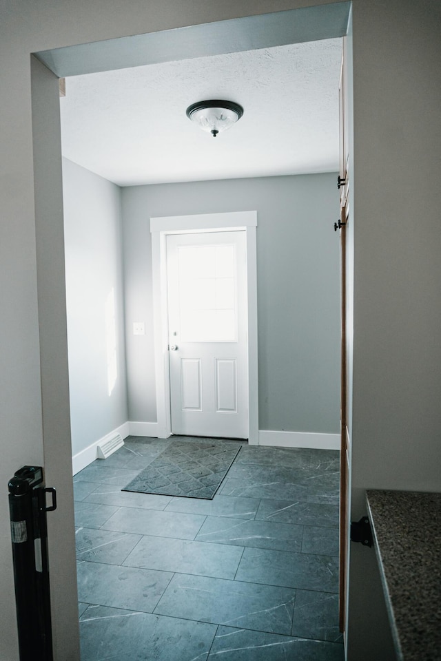 doorway with baseboards