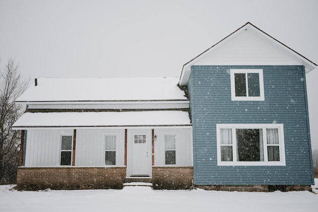 view of front of home featuring brick siding