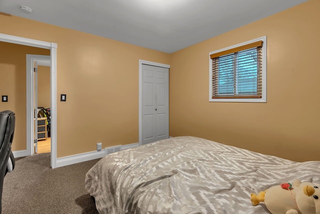 bedroom featuring a closet and carpet flooring