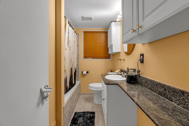 full bathroom featuring vanity, shower / tub combo, tile patterned floors, and toilet