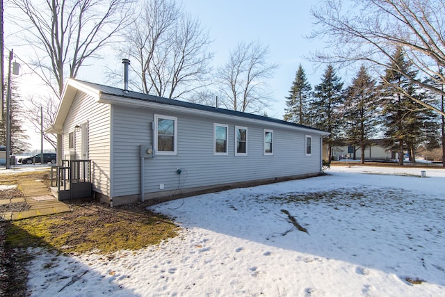 view of snow covered property