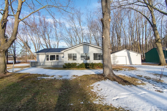 ranch-style house with an outbuilding and a garage