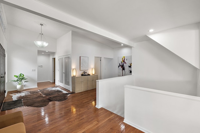 foyer with recessed lighting, baseboards, and wood finished floors