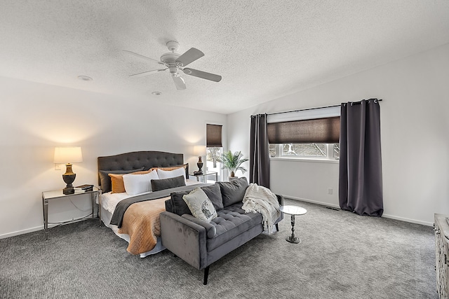 carpeted bedroom featuring a ceiling fan, vaulted ceiling, a textured ceiling, and baseboards