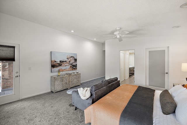 bedroom featuring ceiling fan, a textured ceiling, connected bathroom, light carpet, and baseboards