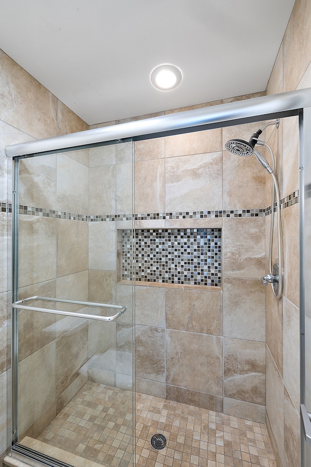 bathroom featuring a shower stall