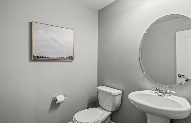 bathroom with toilet and sink