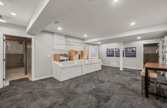 interior space with dark carpet