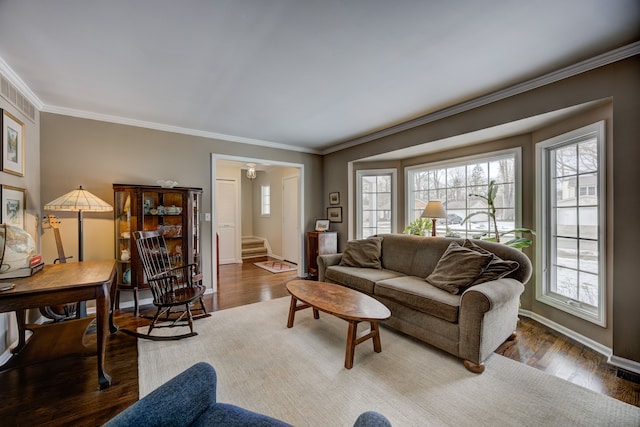 living room featuring crown molding and hardwood / wood-style floors