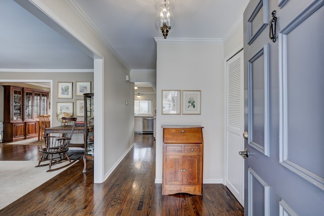 entryway featuring crown molding and dark wood-type flooring