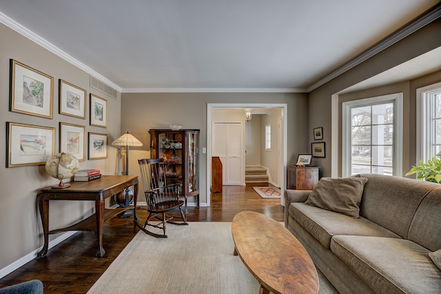 living room with crown molding and dark wood-type flooring