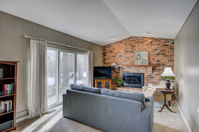 carpeted living room featuring a brick fireplace, a wealth of natural light, and vaulted ceiling