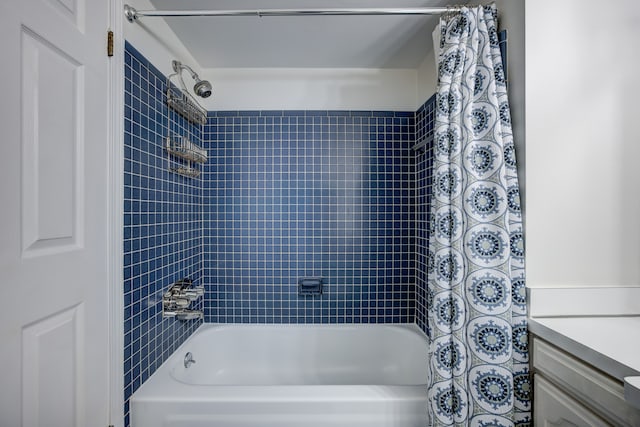 bathroom with vanity and shower / bath combo