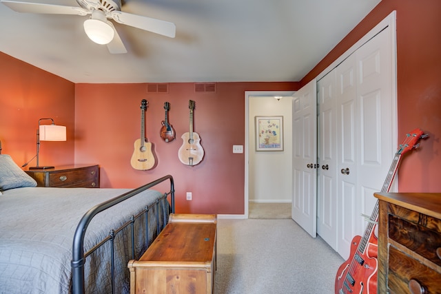 carpeted bedroom with a closet and ceiling fan