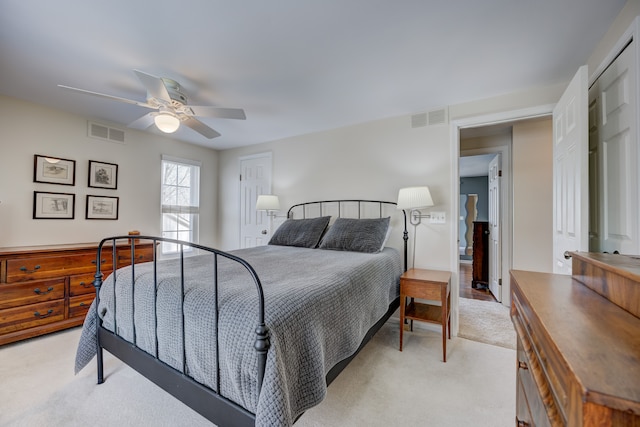 carpeted bedroom with ceiling fan