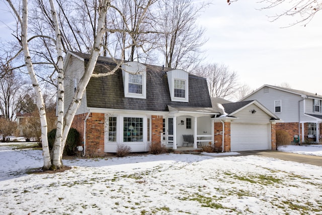 new england style home featuring a garage